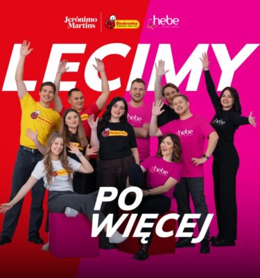 Smiling people waving at the camera. The caption reads: We're coming for more.